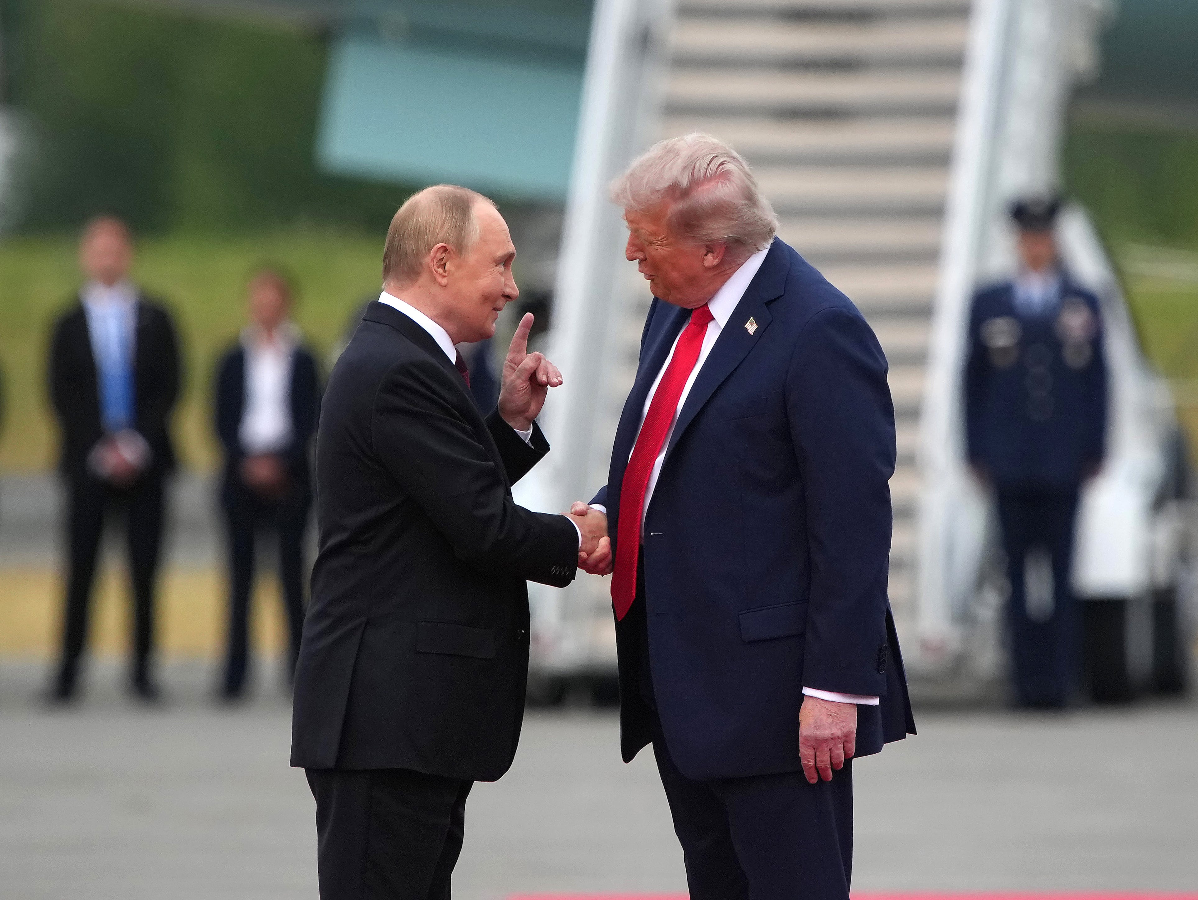 President Donald Trump greets Russian President Vladimir Putin as he arrives at Joint Base Elmendorf-Richardson in Anchorage, Alaska. / Andrew Harnik / Getty Images