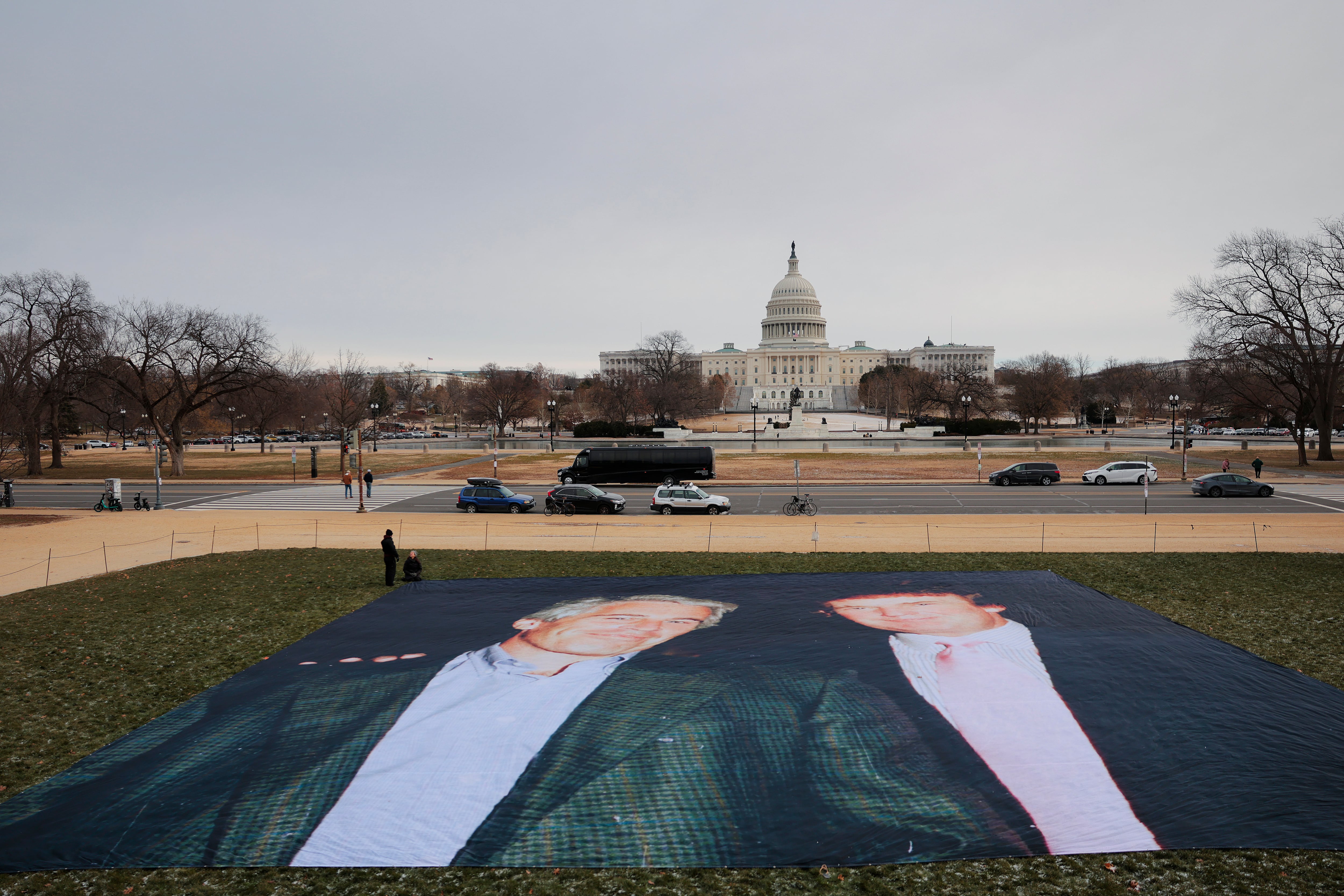 A photo of U.S. President Donald Trump and convicted sex offender Jeffrey Epstein is unfurled on the National Mall near the U.S. Capitol by the political protest organizations Everyone Hates Elon and Glasgow Actions Team on December 15, 2025 in Washington, DC. / Heather Diehl / Getty Images